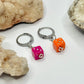 Silver Pink and Orange Dice Huggie Earrings