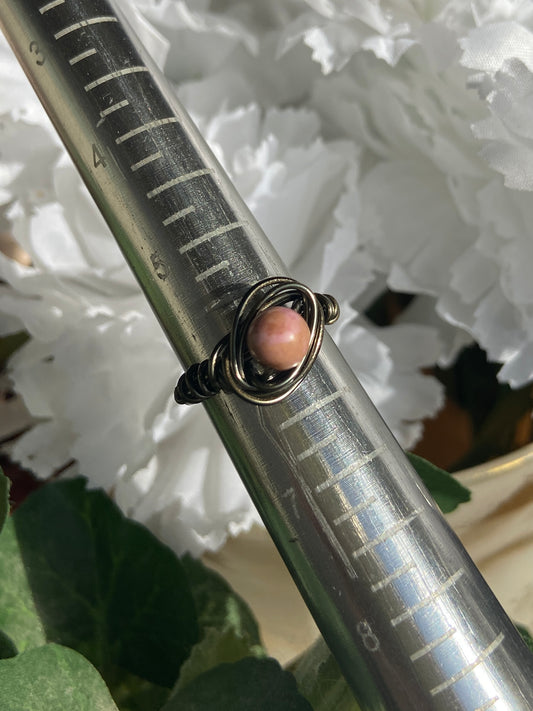 Rhodonite ring with charcoal-colored wire wrapping