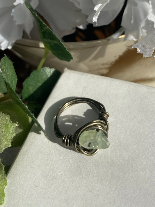 Peridot ring with charcoal-colored wire wrapping