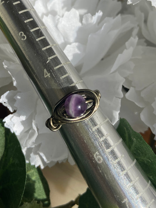 Amethyst ring with charcoal-colored wire wrapping